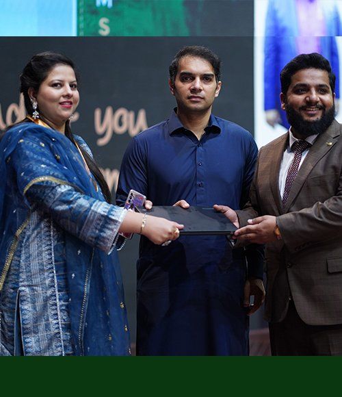 Hajra receiving her award at a PFTP ceremony